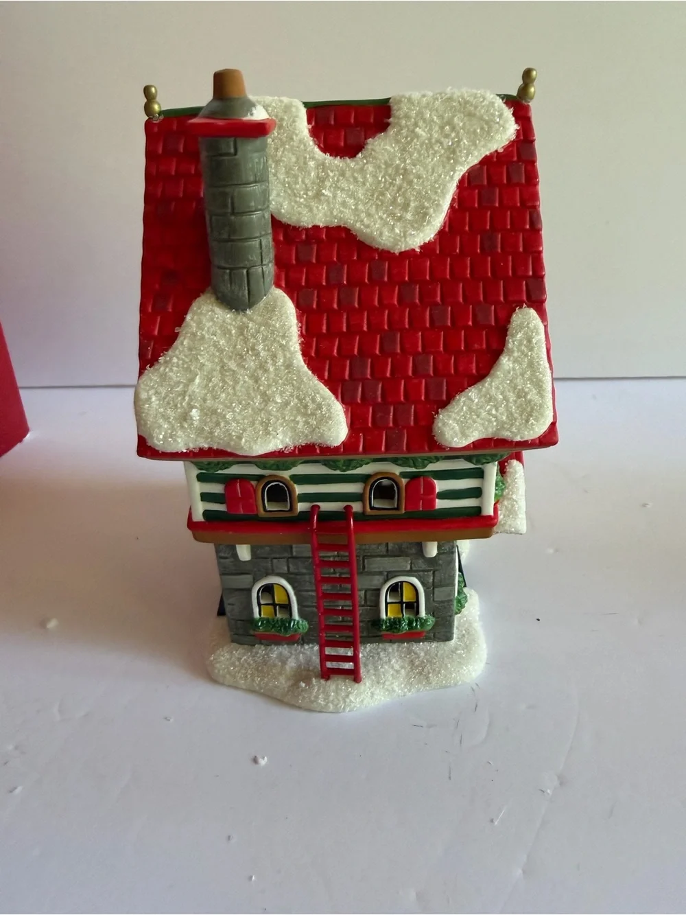 Department 56 Rudolph Hermey's Elf Dormitory - Red, Green, White, Gold
